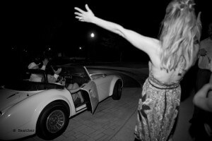 Corissa's Mom & Dad greet her in the Austin Healey getaway car