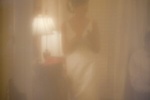 through the window's curtain
