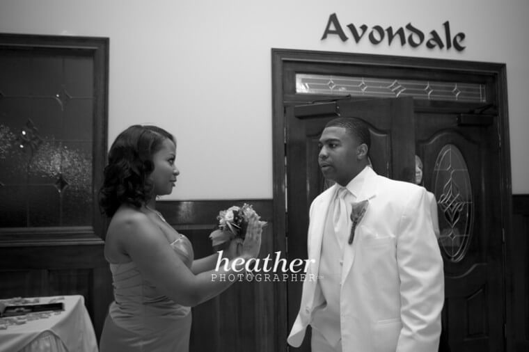 The sister of the bride helps to relax Lenell before the ceremony.