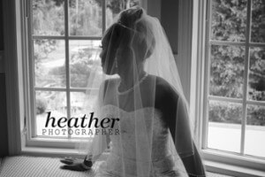 waiting Nina gazes out of the bridal suite window