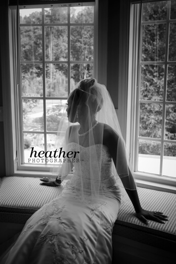 Nina gazes out of the bridal suite window