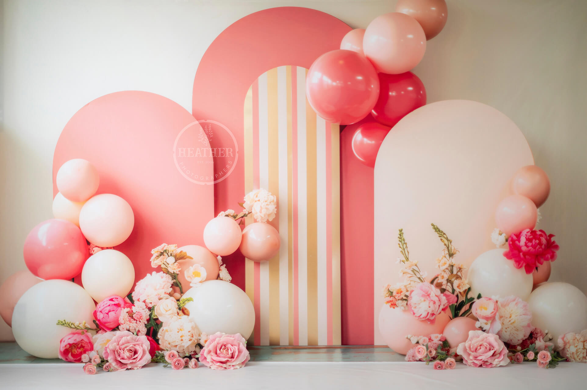 birthday cakes on balloon wall backdrop